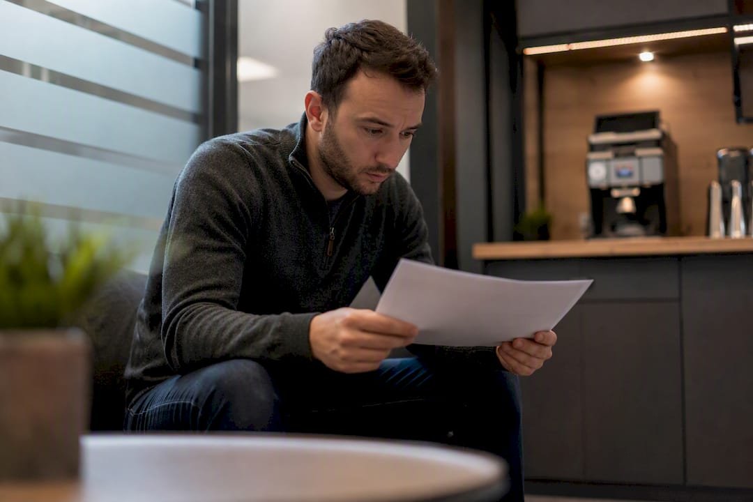 1787515290664_Employee-inspecting-phishing-email-evidence | Total Cyber Solutions Employee inspecting phishing email evidence