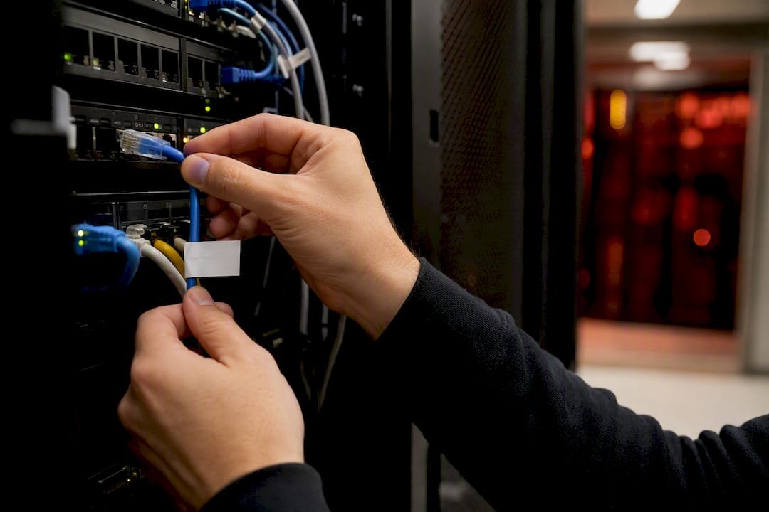 1787646921062_Hands-unplugging-network-cable-to-stop-phishing | Total Cyber Solutions Hands unplugging network cable to stop phishing